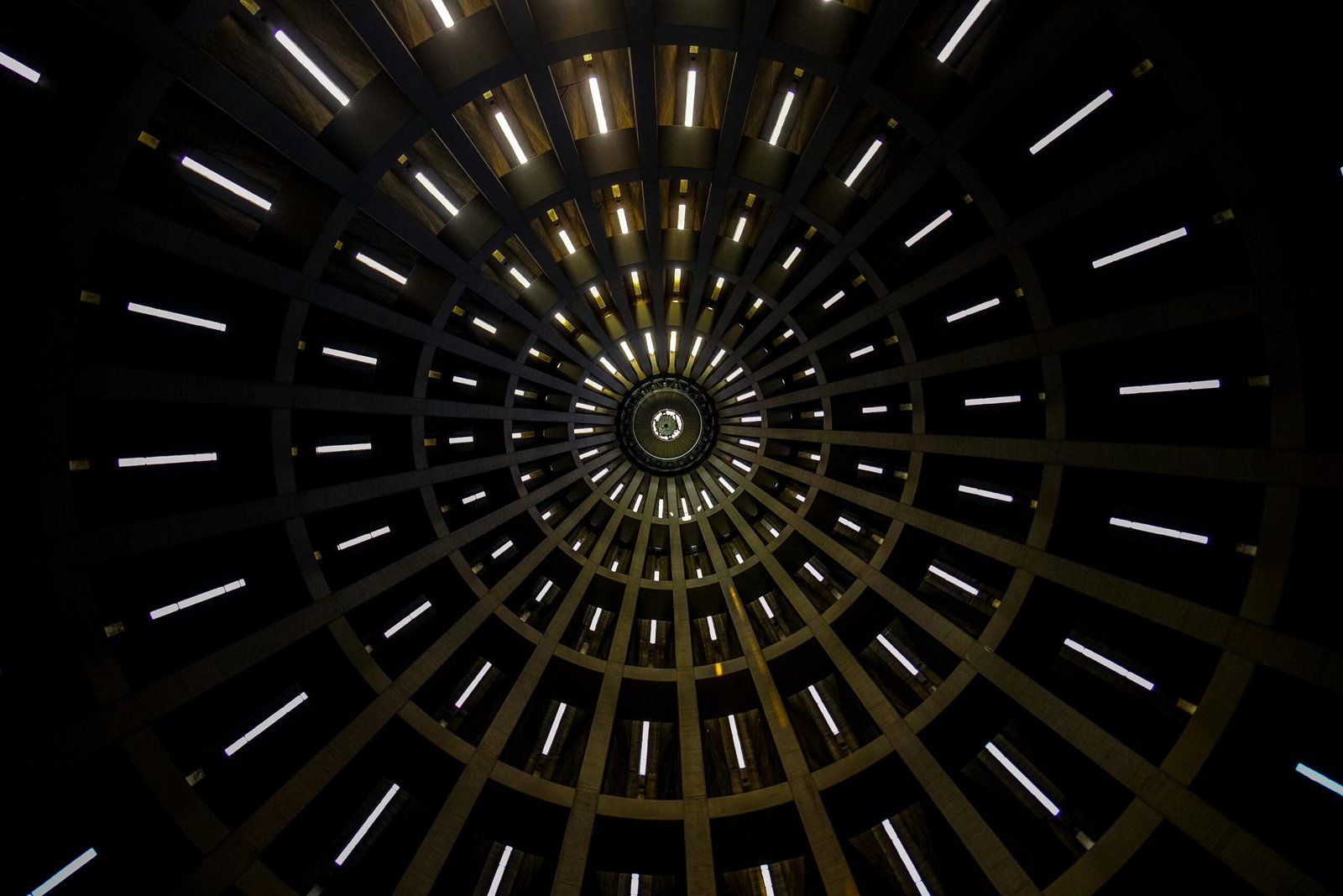 A mesmerizing abstract view of a circular dome with illuminated patterns creating a geometric design.